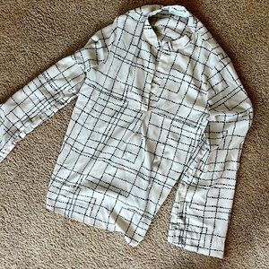 Like new cream and black shirt.